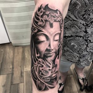 buddha tattoo by @ozzyblacklinetattoo