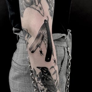 tattoo-spiderweb-and-knife-by-@spookyboytattoos